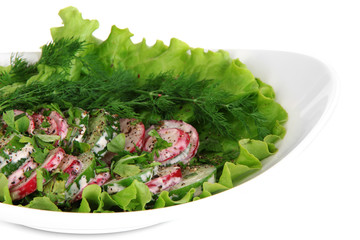 Vitamin vegetable salad in plate isolated on white