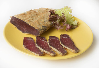 Armenian basturma - jerky beef meat with spices on a plate
