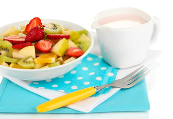 Useful fruit salad of fresh fruits and berries in bowl isolated