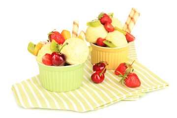 Delicious  ice cream with fruits and berries in bowl isolated