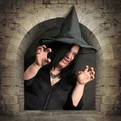 Scary witch rising from the vault. Halloween theme.