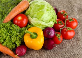 Fresh vegetables on burlap background
