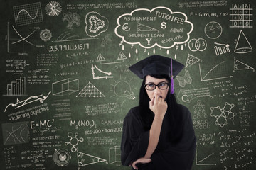Anxious female graduate thinking of fee in class