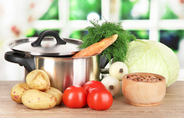 Ingredients for cooking borsch on table in kitchen