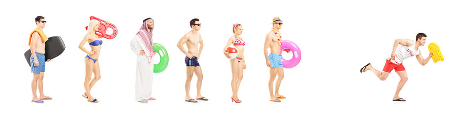 Full length portrait of young people with summer objects