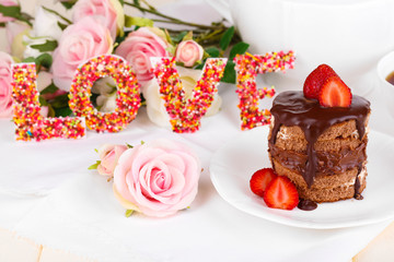 Chocolate cake with strawberry on wooden table close-up