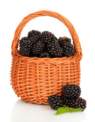 Fototapeta na wymiar Sweet blackberry in wicker basket isolated on white