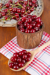 Sweet cherry in wooden basket on table close-up