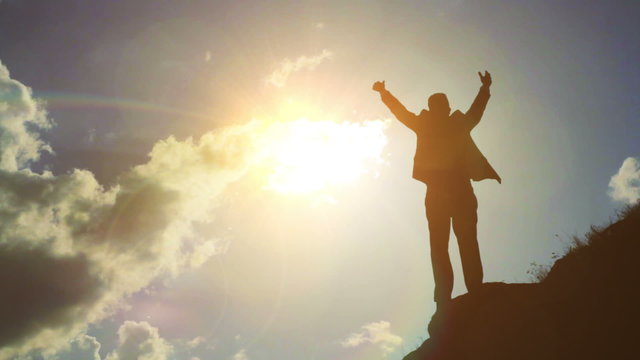 Young Man with suit business reaching success sun flare HD