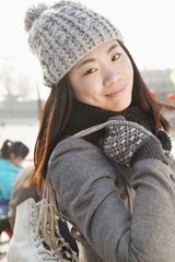 Young woman ice skating portrait, Beijing