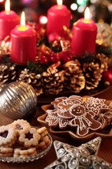 Obraz na płótnie Canvas Christmas cookies and decorations on a table