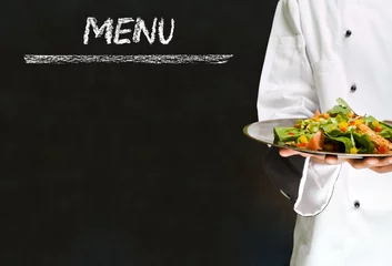 Fotobehang Chef with healthy salad food on chalk blackboard menu background © StockMasters