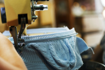 Image of machine knitting blue children's cap