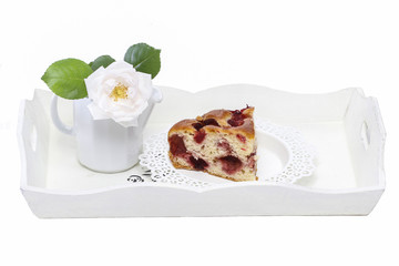 Strawberry cake on white wooden tray