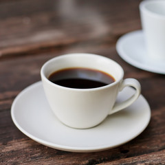 Cups of espresso on a wooden table
