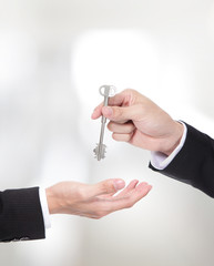 Male hand holding apartment keys