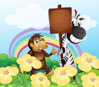 A monkey and a zebra at the garden with an empty board