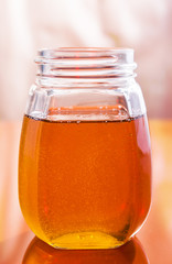 clear sweet tasty honey in a jar