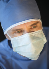 Male Surgeon Wearing Mask And Surgical Cap