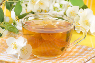 Cup of tea with jasmine flowers