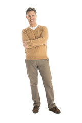 Fototapeta premium Portrait Of Happy Mature Man Standing Arms Crossed