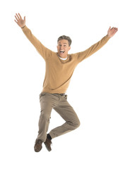 Cheerful Man Jumping Over White Background