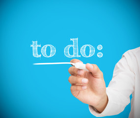 Businesswoman writing to do with a chalk