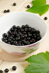 Black currants ripe and natural in a bowl