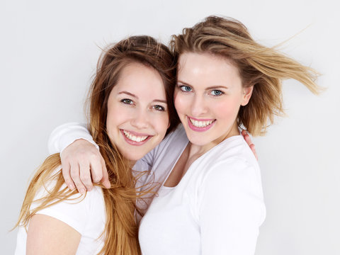 Two girls as a couple, hugging each other