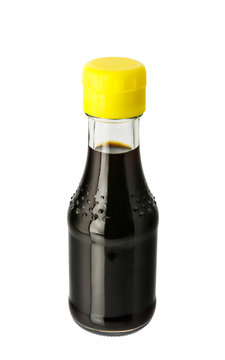 Soy sauce in glass bottle isolated on white background