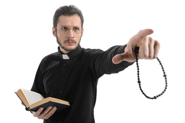 Do you believe in God? Portrait of priest pointing away while st