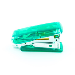 Green transparent stapler isolated on a white background