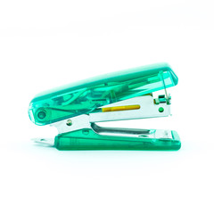 Green transparent stapler isolated on a white background