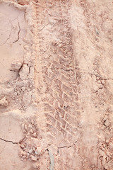 Truck tire tracks in the sand hard