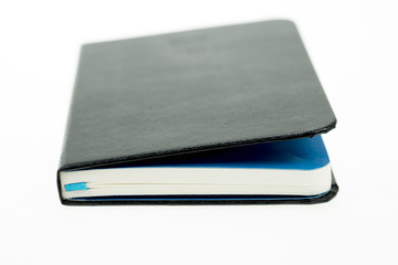 Book for writing down notes on a white background