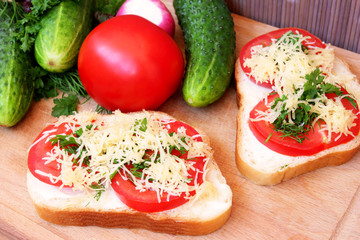sandwiches with tomato, cheese and greens