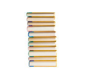 Obraz premium Tall stack of hardcover books on white background, education concept