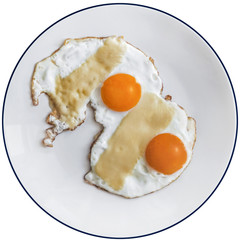 Pair Of Fried Sunny Side Up Eggs With Cheese Slices On White Pla