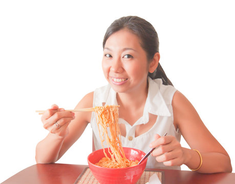 An Asian Woman Eating Noodles, Isolated On White Background