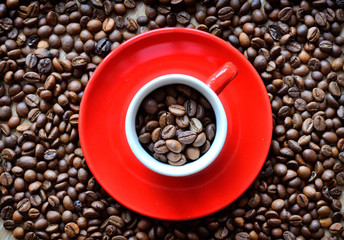 cup with coffee beans on a dark background