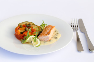 Fish fillet, sauce and vegetables