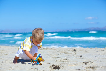 Boy playing with a toy airplane