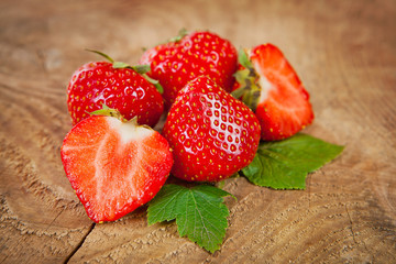 Fresh red strawberries on wooden table
