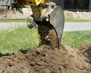 dredger digging with bucket