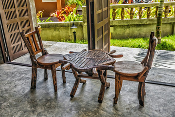 Two old wooden chairs and a table