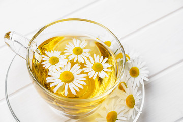 herbal chamomile tea on a white table
