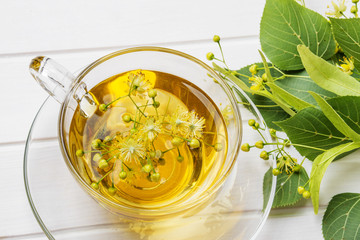 herbal linden tea on a white wooden table