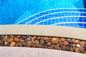 swimming pool blue water detail in summer time