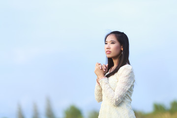 Beautiful Asian woman enjoy nature meadow.