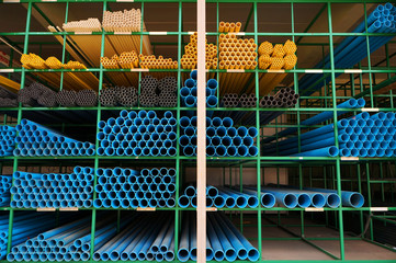 PVC pipes stacked on shelf